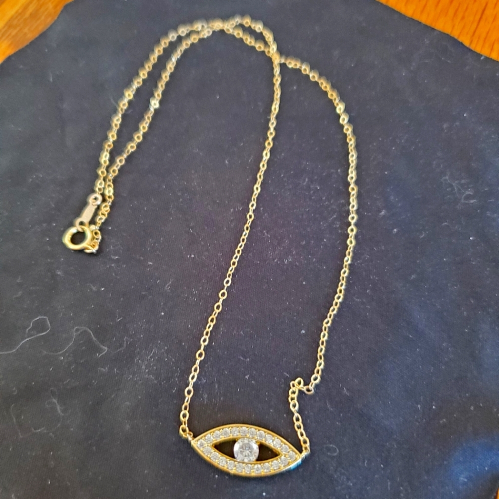 Gold tone gemmed "evil eye" necklace